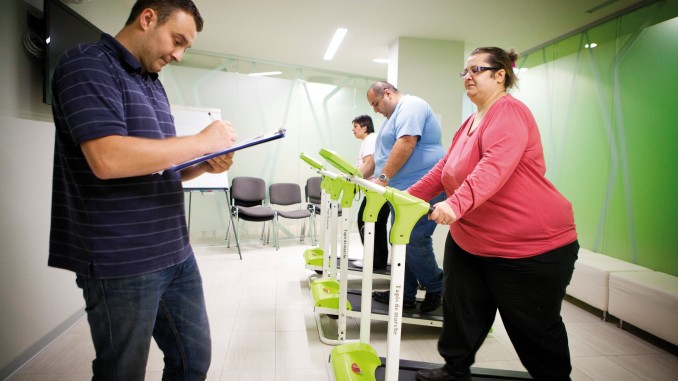 11 Aug 2012, Mulhouse, France --- Reportage in the Obesity Clinic (IPCO) in Mulhouse, France. Physical exercise session with a masseur-physiotherapist. Patients must attend these sessions before and after surgery for obesity. The aim is to get the patient used to doing regular physical exercise again. --- Image by © Amelie-Benoist/BSIP/Corbis