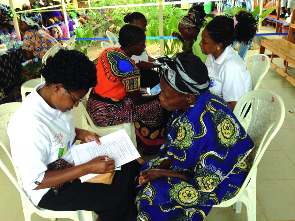 Women in the Iringa region of Tanzania attending a mass screening day for HIV and cervical and breast cancer, November 2015. The organisers, Pink Ribbon, Red Ribbon, make a point of acknowledging that the initiative, which screened 1,500 women over two days, and treated or referred on women who tested positive, relied on having a functioning local health system already in place (see http://tinyurl.com/Screening-Tanzania).